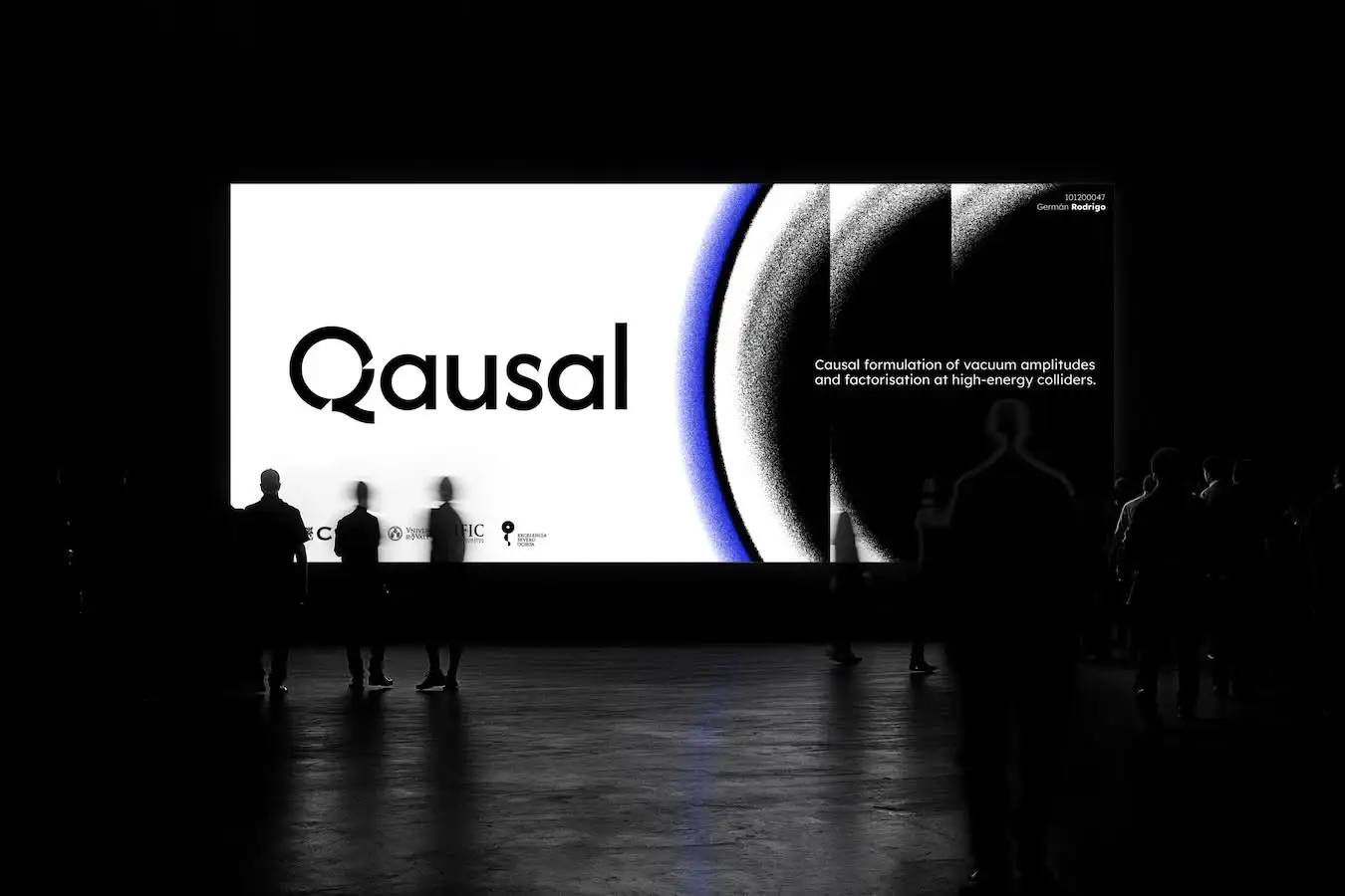Mockup of a huge screen showing the first slide of the keynote presentation and people looking at it.
